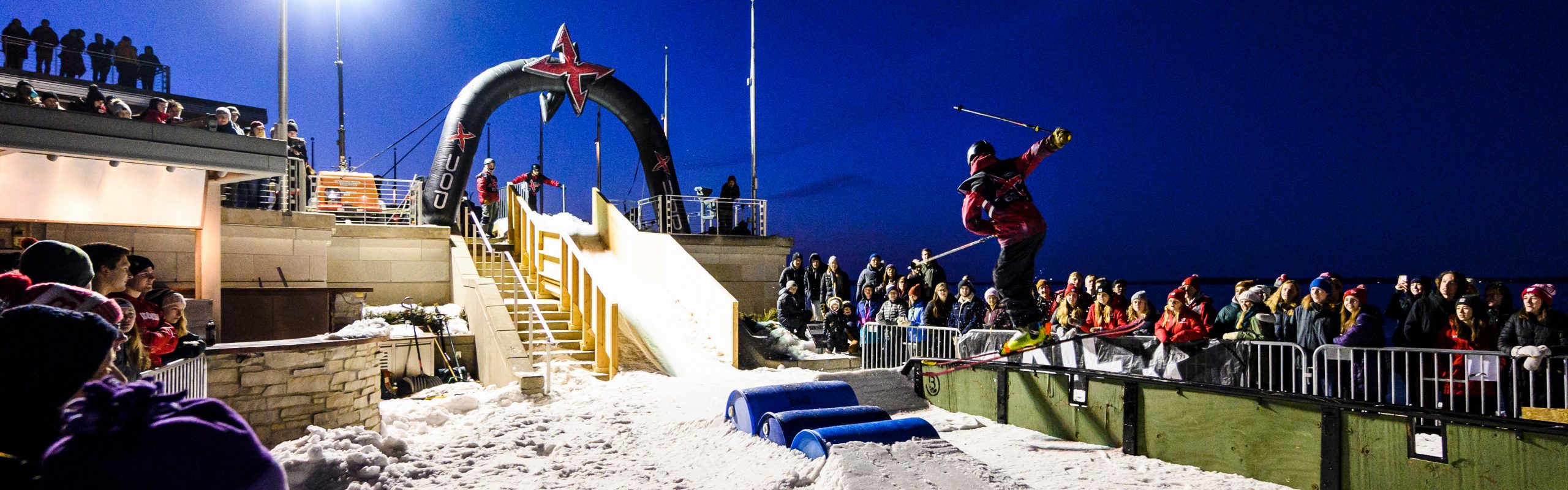 Spectators watch skiers and snowboarders compete during the 11th annual Rail Jam, hosted by the Hoofers Ski and Snowboard Club, at the Memorial Union Terrace at the University of Wisconsin-Madison during winter on Feb. 8, 2020. The event was part of the weeklong Wisconsin Union Winter Carnival. (Photo by Brian Huynh / UW-Madison)