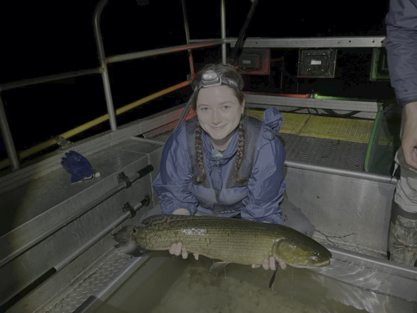 Emma holding a fish